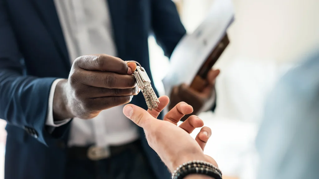 real-estate-agent-handing-house-key
