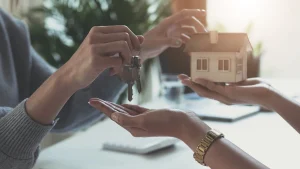 Estate agent giving house keys