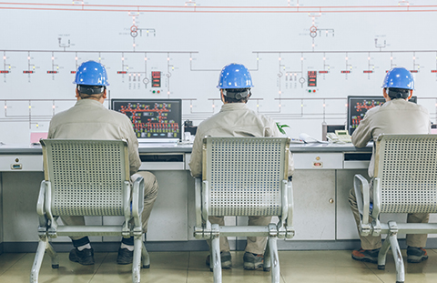 Workers in control room